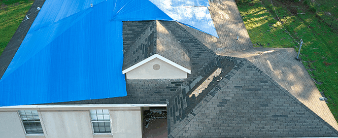 damaged roof with tarp