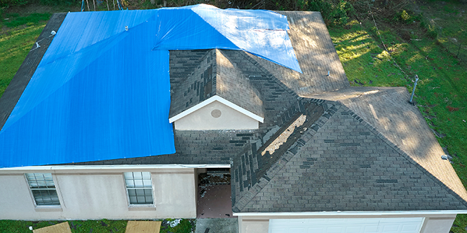 damaged roof with tarp