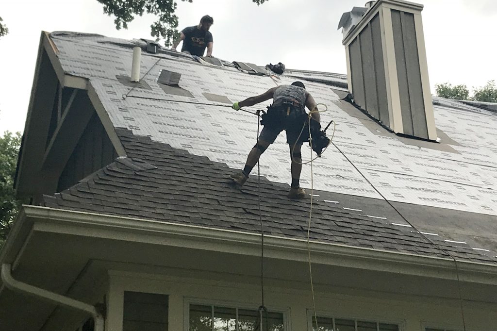 Picture of people working on steep roof – for blog steep roof
